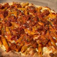 Penne Vodka Pizza (Medium) · Penne all a vodka baked on top the pizza.