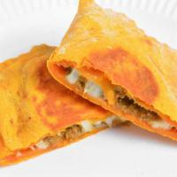Jamaican Beef Patty · Rich flaky yellow pastry dough filled with seasoned ground beef