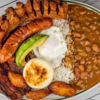 Bandeja Tipica · Grilled steak, pork rind, rice, beans, fried egg, sweet plantain, and avocado.