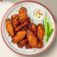 Devil Wings · Our famous wings fried until perfectly golden and crispy and tossed in buffalo sauce. Served...
