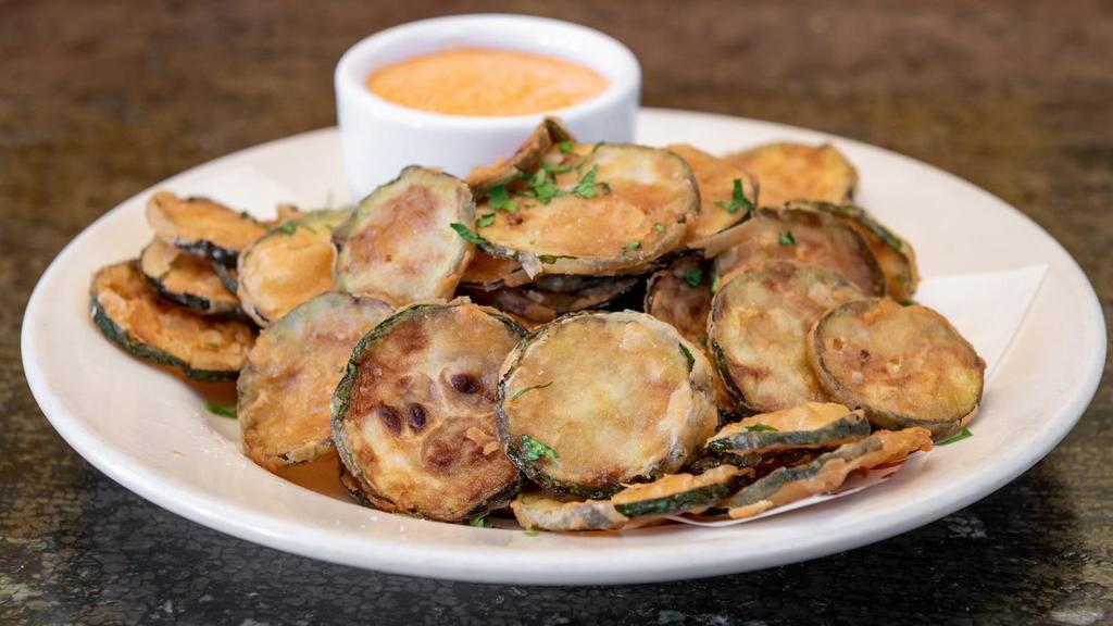 Zucchini Chips · Served with yogurt dipping sauce.