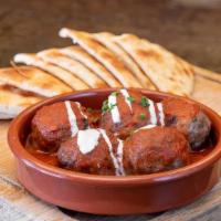 Moroccan Meatballs · In fresh tomato sauce and topped with Greek yogurt. Served with toasted pita.