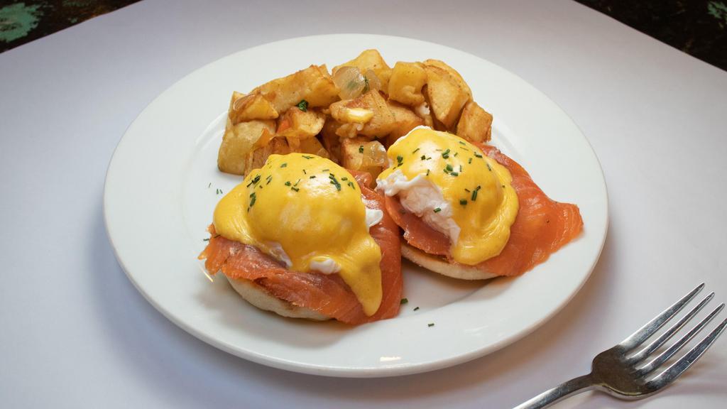 Eggs Norwegian · Served with smoked salmon, sauteed spinach, Hollandaise & French fries.