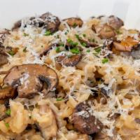Wild Mushroom Risotto · With shiitake, cremini & portobello mushrooms and topped with parmesan cheese.