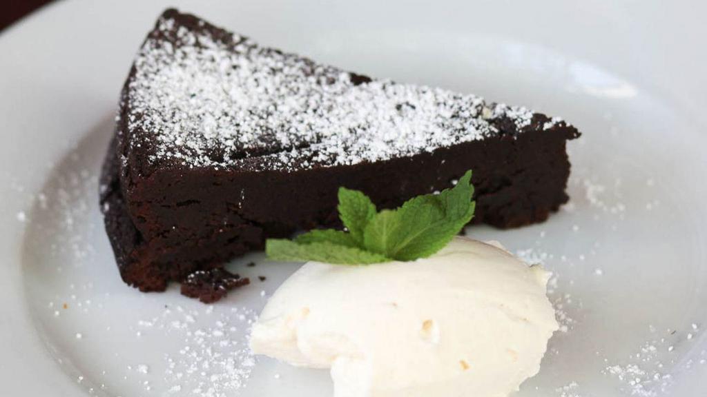 Flowerless Chocolate Cake · Served with whipped cream.