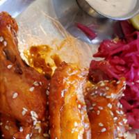Chipotle Honey Chicken Wings · Spicy chipotle wings with bleu cheese dressing and cabbage slaw.