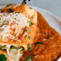 Chile Relleno · Poblano pepper filled with Oaxaca cheese in red tomato sauce. Served with rice and beans.