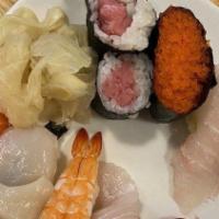 Sushi Regular · Assorted 8 pieces of sushi and half tuna roll.