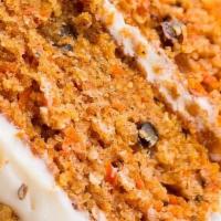 Pedazo De Bizcocho Zanahor · Bizcocho de Zanahoria con Frosty de Quezo Crema
Piece of carrot cake with frosty cream cheese