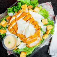 Caesar Salad · Chopped romaine hearts, parmesan cheese, croutons and Caesar dressing.