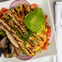 Cobb Salad · Sliced grilled chicken breast, served on a bed of tossed salad and fresh vegetables. Garnish...