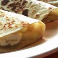 Quesadilla · Flour tortilla served with sour cream and guacamole on the side.