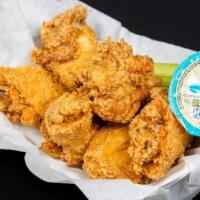 Chicken Wings · Your choice of breaded or naked tossed in your choice of sauce.