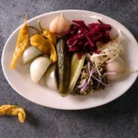 Assorted Seasonal Pickles · A variety of fresh garden vegetables fermented with regional spices.