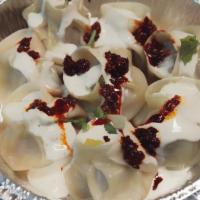 Beef Momo · Steamed dumplings filled with minced beef, scallions and some herbs.