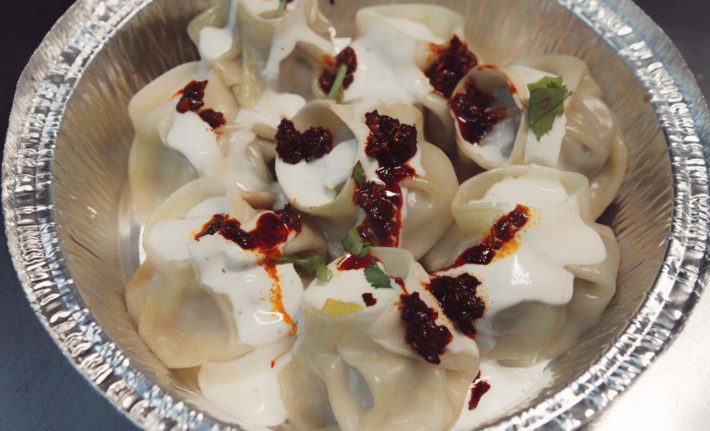 Beef Momo · Steamed dumplings filled with minced beef, scallions and some herbs.