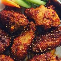 Chicken Wings · Serves with 7 pieces of fried chicken wings with mixture of Our signature sauce “Sweet Spicy...