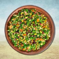 Tabouli Parsley Salad · Finely chopped parsley with tomatoes, onions, bulgur seasoned with olive oil, lime juice sea...