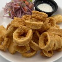 Chicharrón De Calamar / Fried Squid · Calamares fritos ligeramente empanizados, yuca frita y salsa criolla. Servido con salsa tárt...
