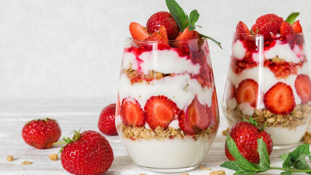 The Skinny Parfait · Creamy, thick Greek yogurt generously topped with strawberries, blueberries, mango, almonds and honey.