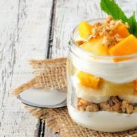 The Tropical Parfait · Creamy, thick Greek yogurt generously topped pineapple, mango, coconut flakes and hemp seeds.