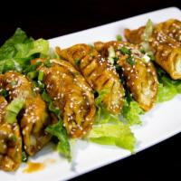 Pot Stickers · Bite sized of pastry stuffed with seasoned pork lightly steamed and grilled to a crisp finis...
