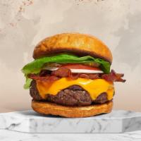Bacon. Burger. · American beef patty topped with melted cheese, layers of crispy bacon, lettuce, tomato, onio...