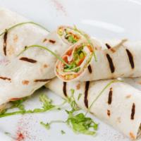 Pesto Wrap · Pesto, organic eggs, fresh mozzarella, and roasted red peppers wrapped perfectly in your cho...