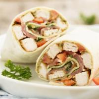 Greek Wrap · Delicious Wrap full of Romaine lettuce tossed with diced tomatoes, red onion, feta cheese, l...