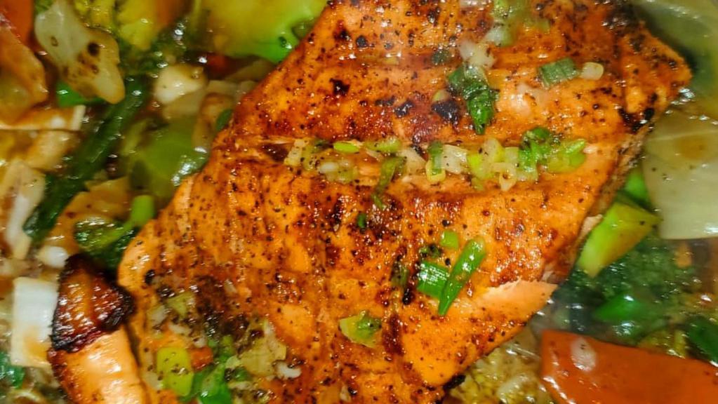Flavorful Salmon · Served with rice, cabbage, and plantains or mixed vegetables. Salmon styles include - grilled, teriyaki, garlic and butter, or jerk.