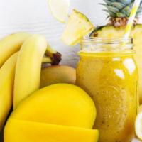 Pineapple, Mango, Banana And Orange Smoothie · Refreshing smoothie with pineapple, mangoes, bananas and oranges.