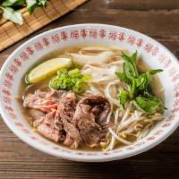 Classic Pho Noodle Soup · Choice of beef. Served with beef broth soup, onion, scallion, lemon, basil, and bean sprout ...