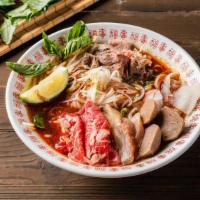 P02 . House Spicy Pho Noodle Soup / 辣味火车头 2 · Comes with Rare Eye Roud, Brisket, Tripe and Tendon, Beef balls with rice noodles, served wi...