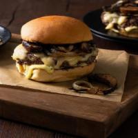 Bb'S Mushroom Swiss Burger · Two beef patties with swiss cheese on a bun loaded with grilled mushrooms, lettuce, onion an...