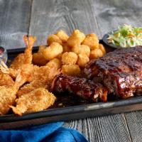 Ribs And Shrimp · Our barbecue half-rack served with crispy jumbo shrimp. Served with two sides.