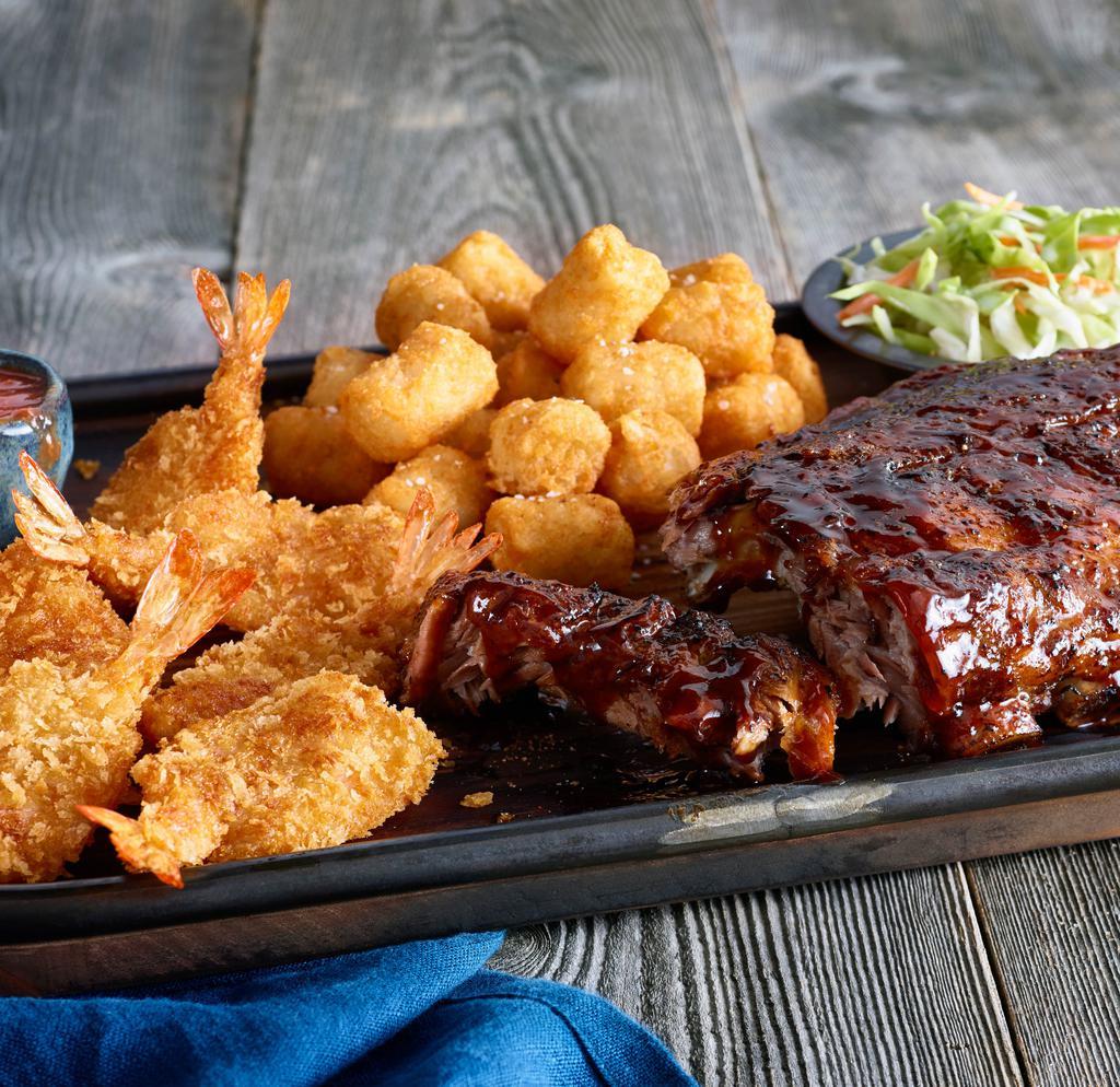 Ribs And Shrimp · Our barbecue half-rack served with crispy jumbo shrimp. Served with two sides.