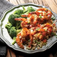 Cajun Grilled Shrimp & Rice · Cajun style grilled shrimp topped with spiced lemon butter sauce. Served with dirty rice and...