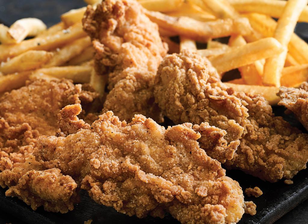 Chicken Tenders · Double-dipped in our signature buttermilk batter and fried to a crisp golden brown. Served with fries, your choice of side and honey mustard.