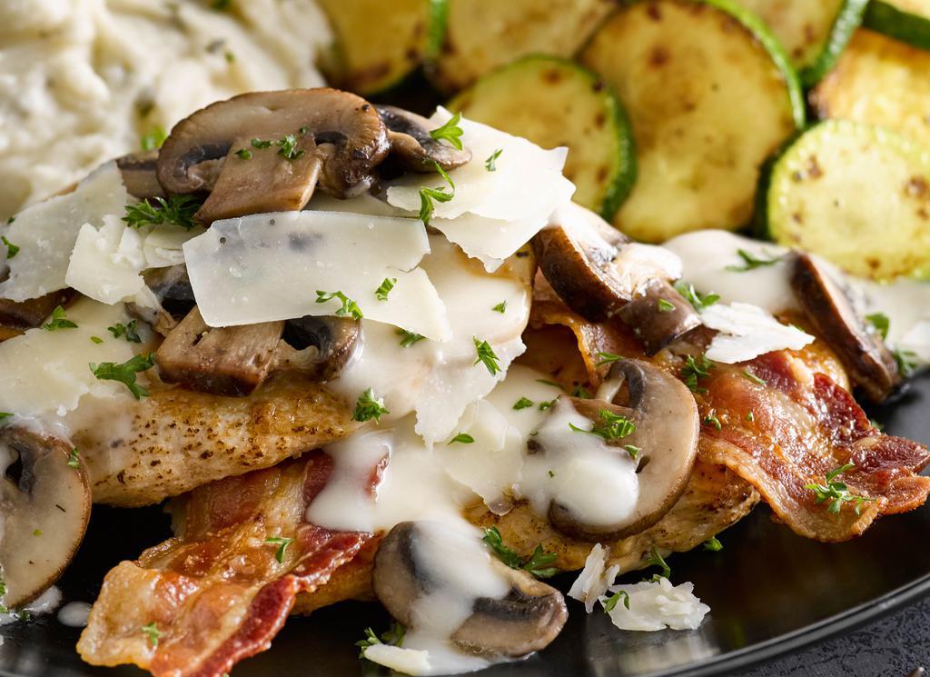 Asiago Bacon Chicken · We recommend these flavorful favorites any day. Grilled chicken breasts with baby ‘bella mushrooms, bacon, Parmesan cream sauce and Asiago cheese. Served with two sides. 710 cal.