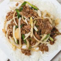 Mongolian Beef / 蒙古牛 · Sliced beef mixed with mushrooms, scallions, onions topped with sesame seeds.  Spicy. With w...