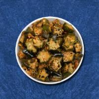 Stir Fried Okra · 24 oz. Stir-fried okra cooked with onion, tomato, garlic, and Indian spices. Served with a s...