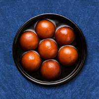 Dumpling Desire · 3 pieces. Village cheese balls dipped in a sugar-based cardamom flavored syrup.