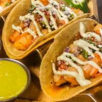 Tacos · Seasoned and grilled with red onion, tomato, jalapeño, cotija cheese, cilantro, side salad, ...
