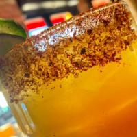 Jalapeno Mango Margarita · tequila, mango puree, muddled jalapeno, lime juice, agave nectar, chili-sugar-salt rim