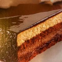 Chocolate Temptation  · Chocolate layer cake, chocolate cream, hazelnut cream, hazelnut crunch, chocolate glaze