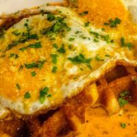 Savory Waffle · crumbled sausage, black pepper gravy, fried egg, local maple syrup