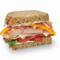 Turkey & Cheddar Sandwich · Toasted multigrain bread with lettuce, tomato, onion, and mayo.