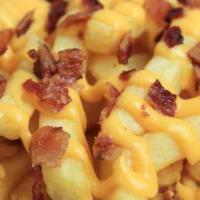Bacon Cheese Fries · French fries covered in cheese sauce and shredded cheese tossed in bacon bits.