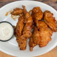 Honey Garlic Wings · 9 jumbo wings tossed in a sweet spicy honey garlic sauce. Served with a side of buttermilk r...