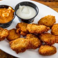 Fried Pickle Chips · Pickle slices hand breaded in house and fried to perfection. Served with a side of chipotle ...